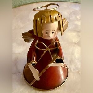 Small, painted metal or tin angel figurine For Xmas or general decoration.